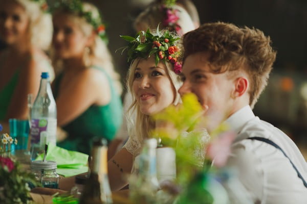 Bride and groom listening to speech