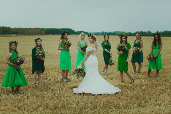 Bride and bridesmaids in corn field