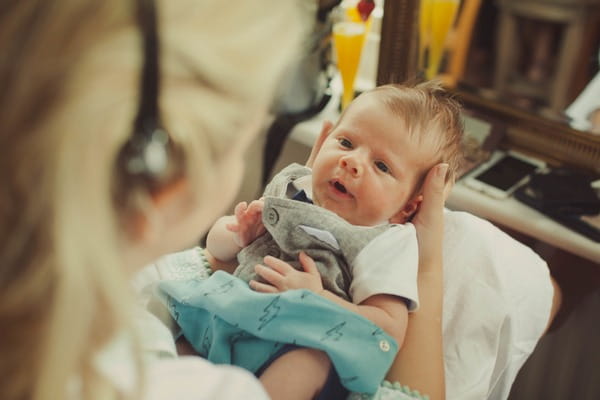 Bride holding baby