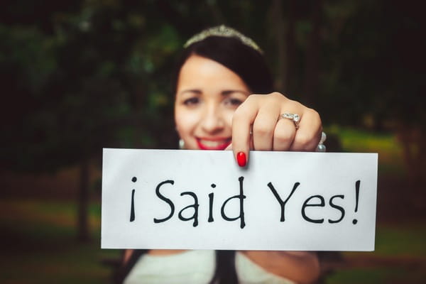 Bride holding I Said Yes sign