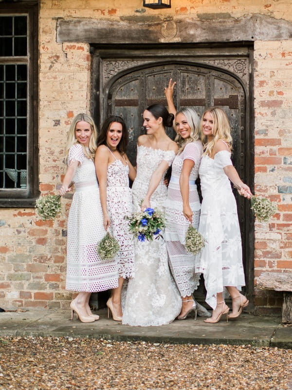 Bridesmaids wearing mismatched dresses