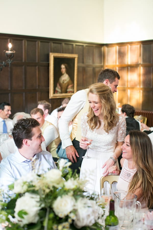 Bride talking to guests during wedding breakfast