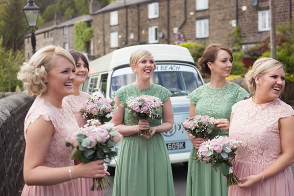 Bridesmaids in green and pink dresses