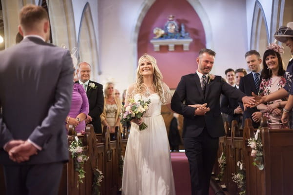 Father walking bride down the aisle