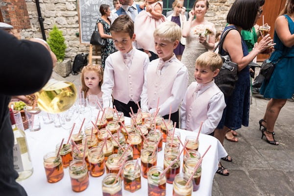 Children getting reception drinks at Scaplen's Court wedding