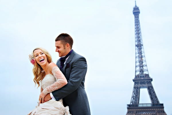 Bride and groom with Eiffel Tower in background - Picture by Martin Dabek Photography