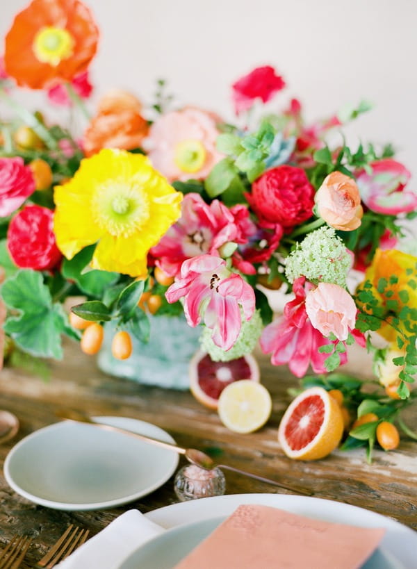 Bright, colourful flowers on table for elopement dinner