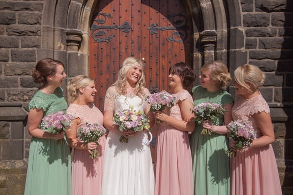 Bride with bridesmaids outside church