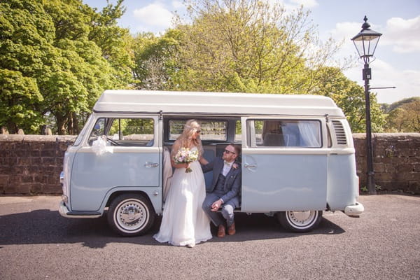 Bride and groom with camper van