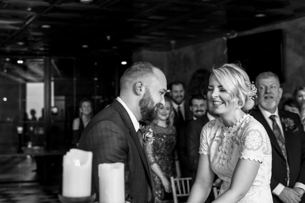 Bride and groom laughing during wedding ceremony