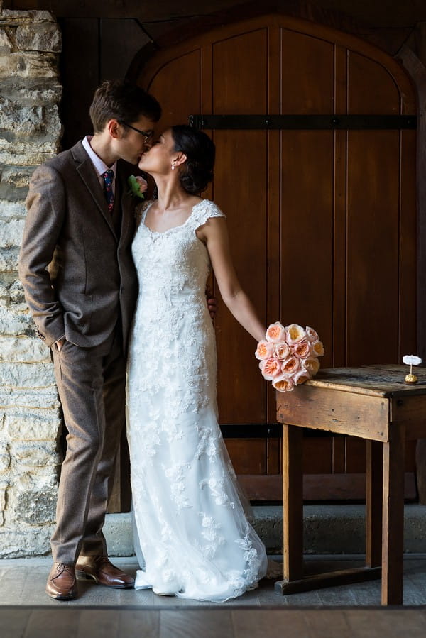 Bride and groom kissing