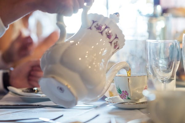 Pouring tea from teapot