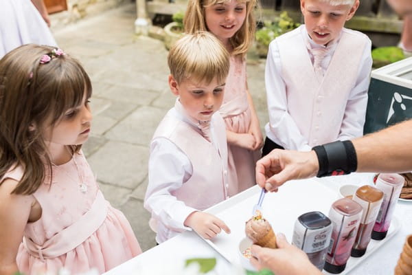 Children being served ice cream