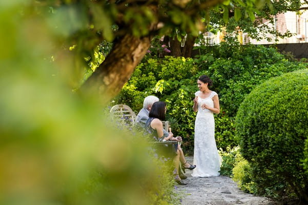 Bride talking to wedding guests