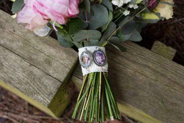 Brooches on stem of bridal bouquet