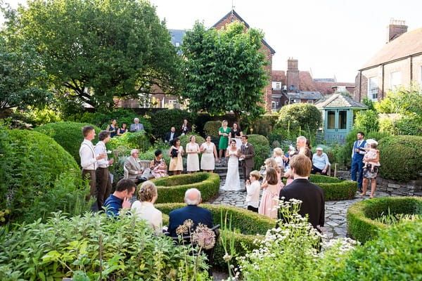 Wedding guests in Scaplen's Court garden