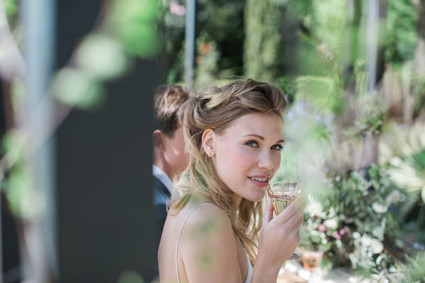 Bride holding drink