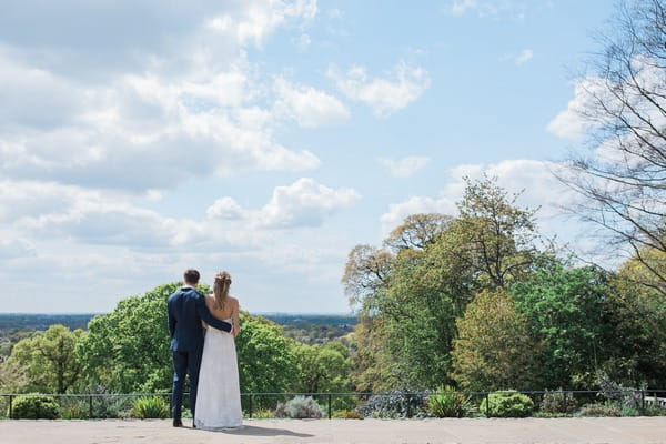 Bride and groom looking at view from Pembroke Lodge