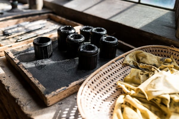 Small black pots on window ledge