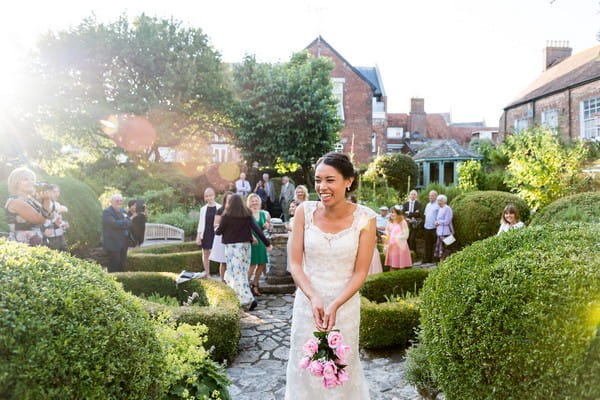 Bride about to toss bouquet