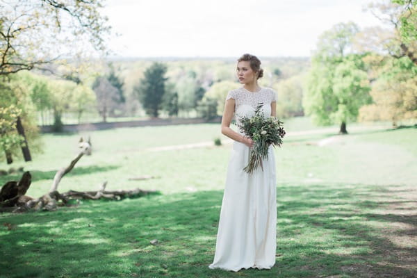 Bride standing with bouquet