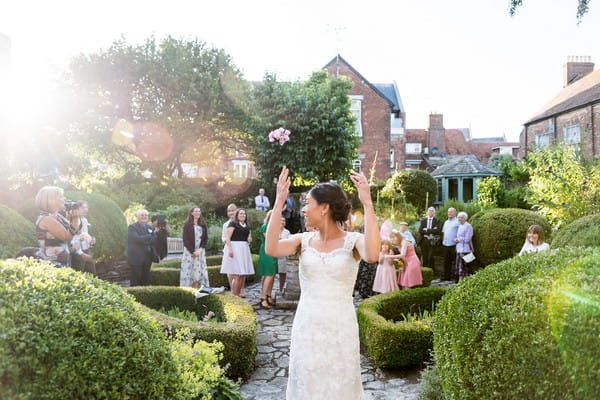 Bride tossing bouquet