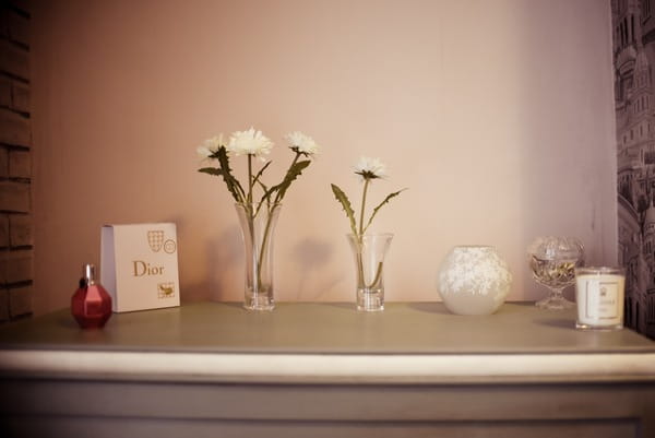 Small vases and perfume on dresser