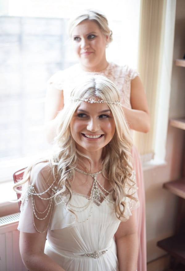 Smiling bride with forehead chain