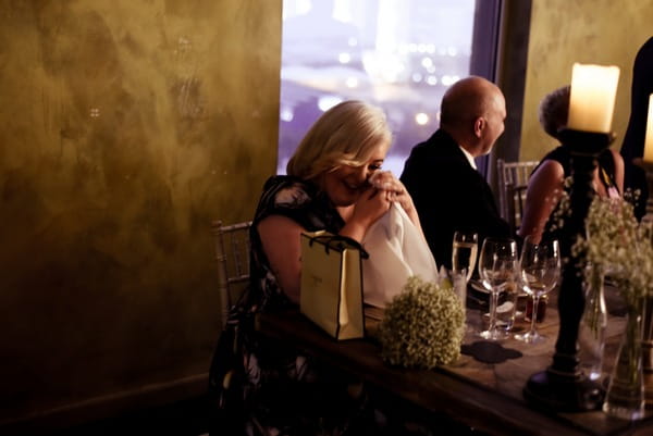 Emotional woman listening to wedding speech