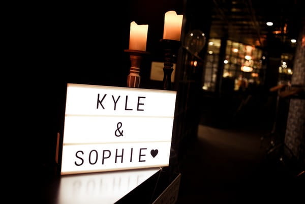 Illuminated sign with bride and groom's names