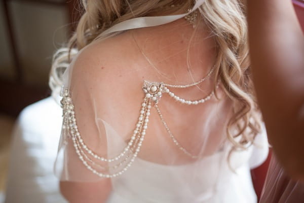 Beaded cape on bride's dress