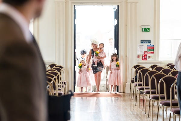 Flower girls entering wedding ceremony