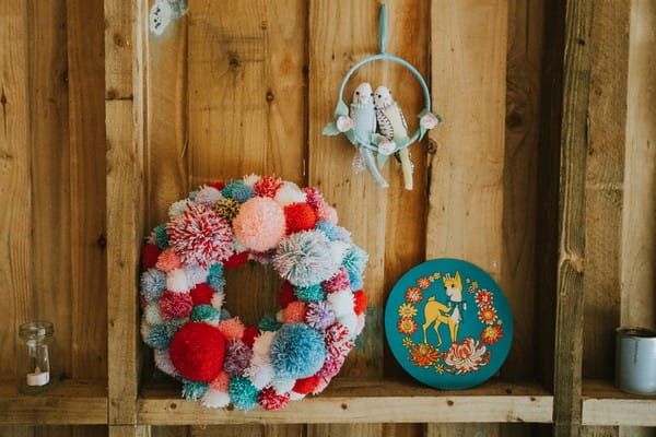 Wreath of colourful pom poms