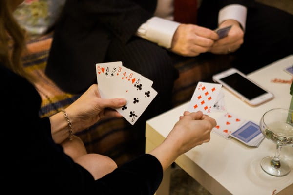 Wedding guests playing cards