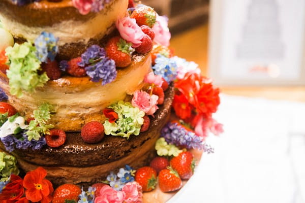 Close-up of fruit on naked wedding cake