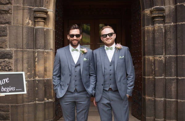 Groom and best man at entrance to church