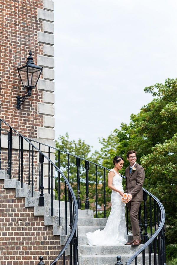 Bride and groom on steps of Poole Guildhall