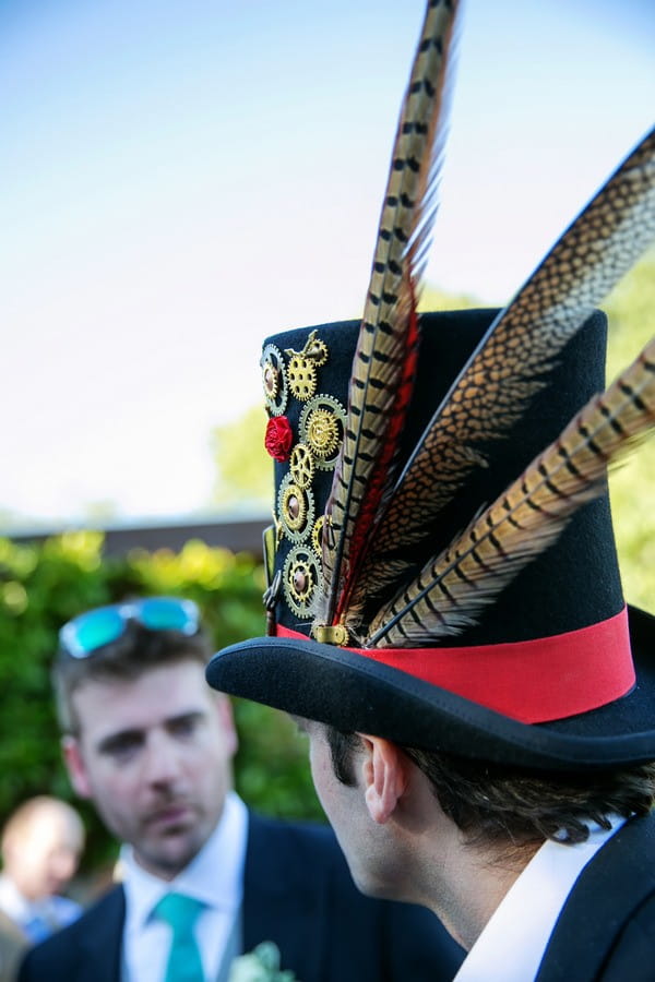 Wedding Guest Wearing Top Hat with Feathers
