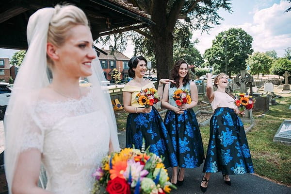 Bride and bridesmaids outside church