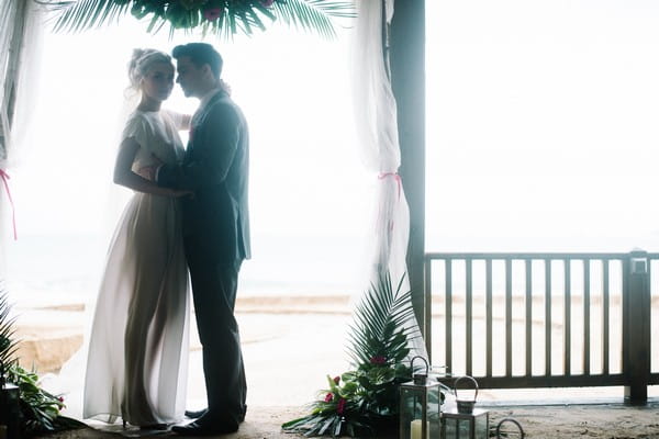 Bride and groom in beach hut