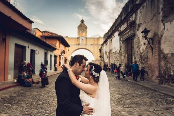 Bride and groom on street in Antigua, Guatemala