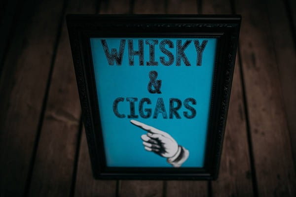 Whisky and cigars sign