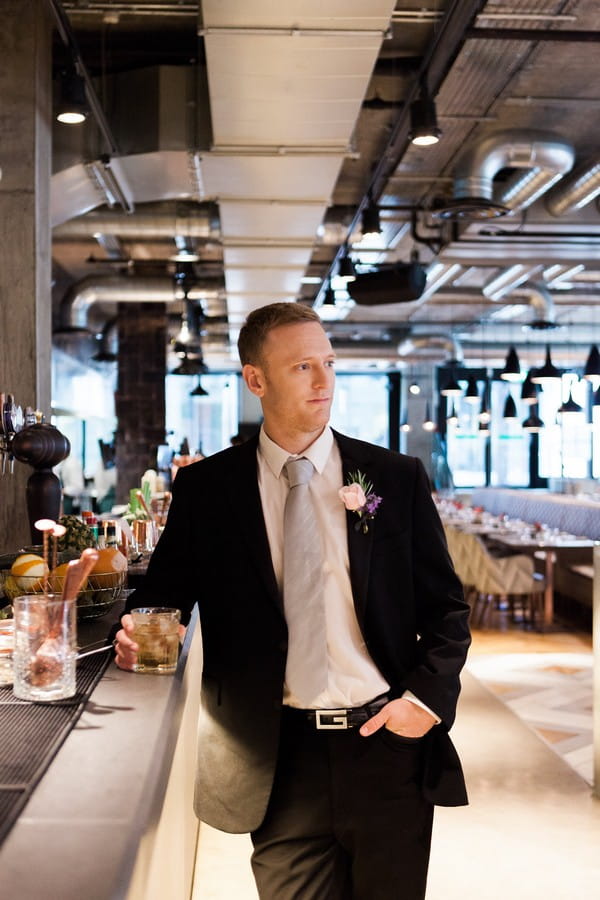 Groom in bar at Drake and Morgan at King's Cross