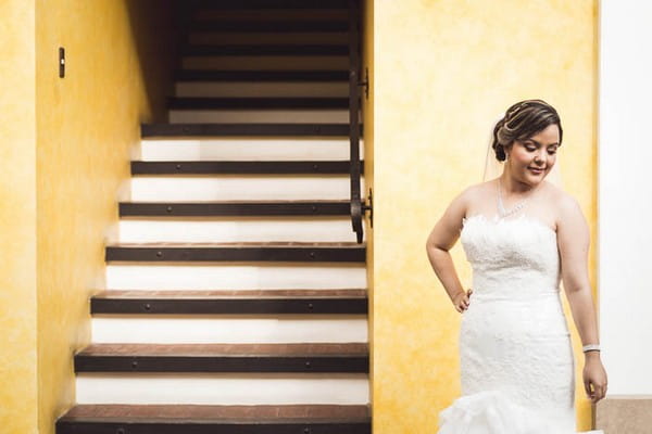 Bride standing by stairwell