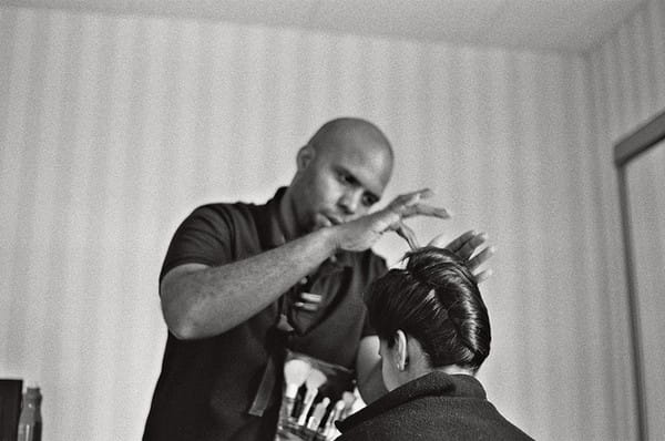 Hairstylist Creating French Twist Hairstyle