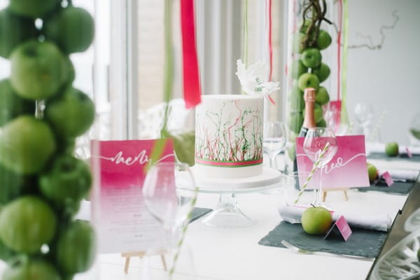 Cerise pink and green wedding table styling