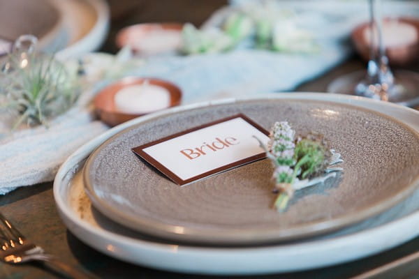 Copper bride name card on plate