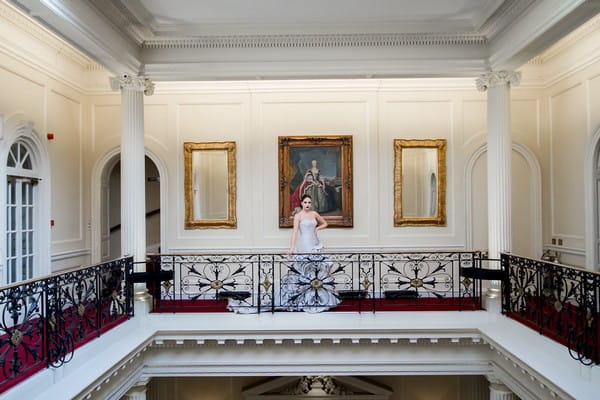 Bride on gallery at Hedsor House