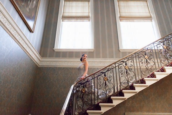 Bride walking down stairs at Hedsor House