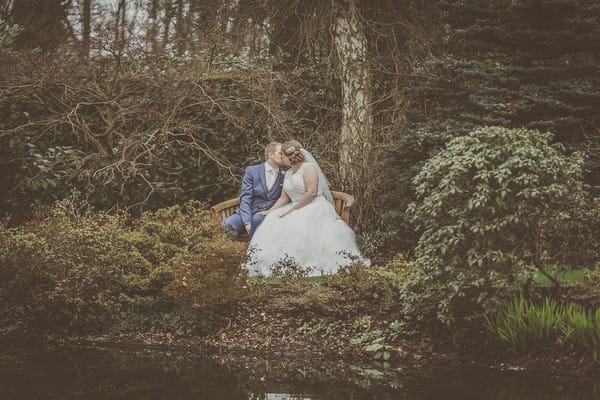 Bride and groom in grounds of Rivervale Barn